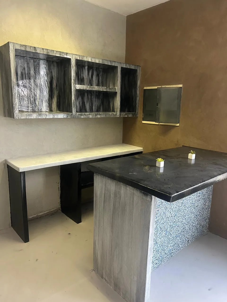 The same bar area finished, with decorative walls and a speckled counter front